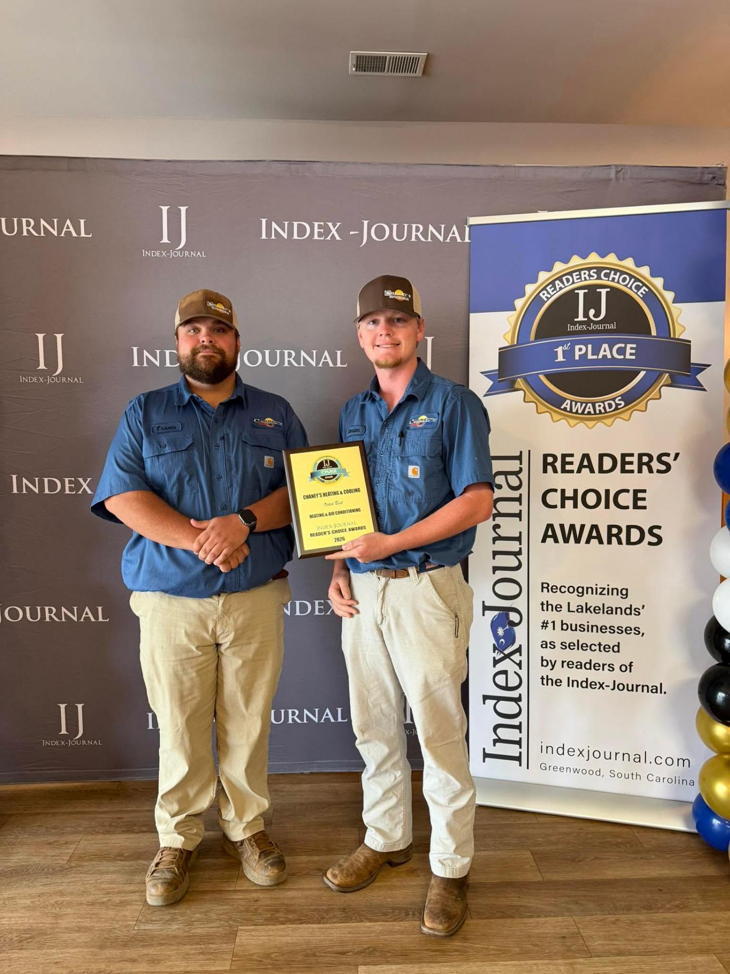 Chaney's Heating & Cooling team holding their Index-Journal Readers' Choice 1st Place award